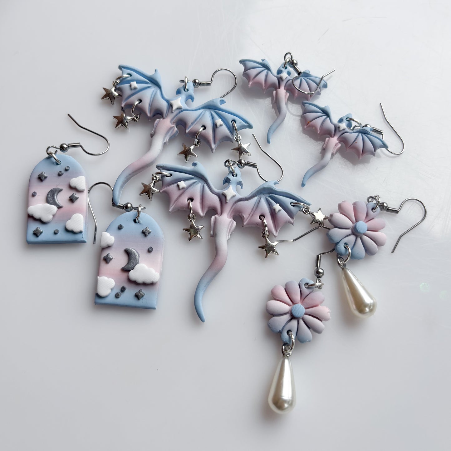 CLOUDY ARCH EARRINGS (TRANS FLAG)