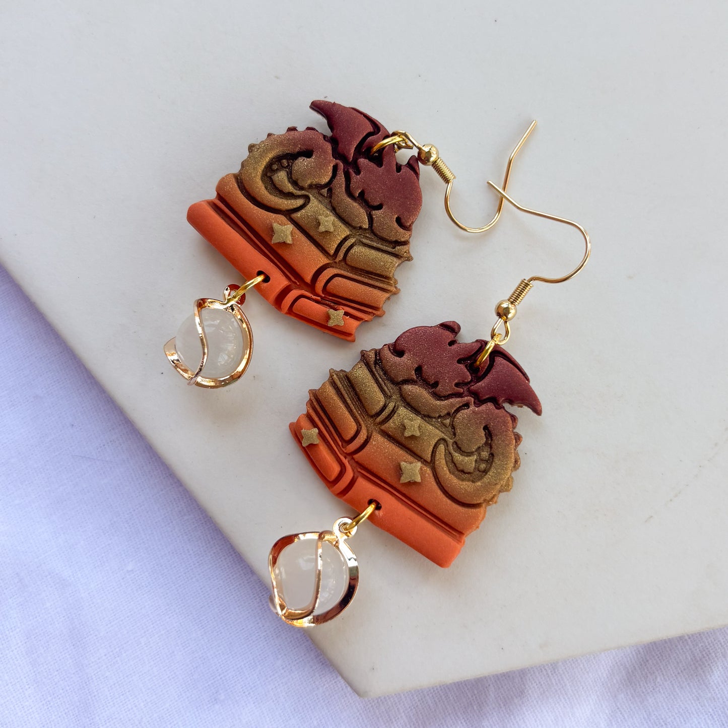 DRAGON ON BOOKS EARRINGS (BRICK BRONZE ORANGE)
