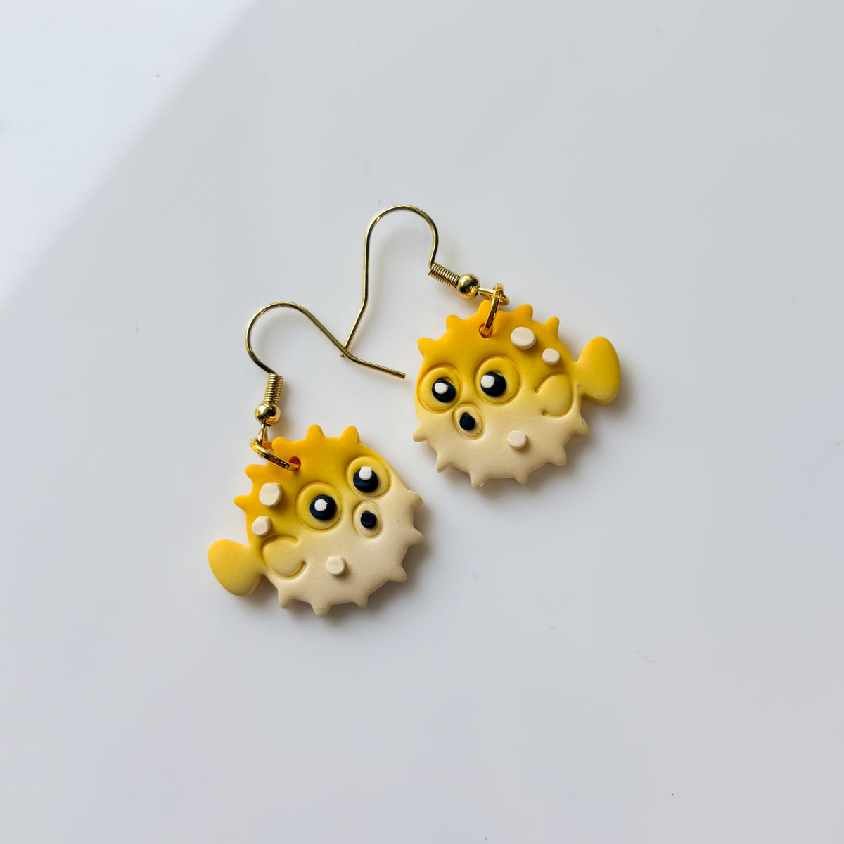 YELLOW PUFFER ANIMAL EARRINGS