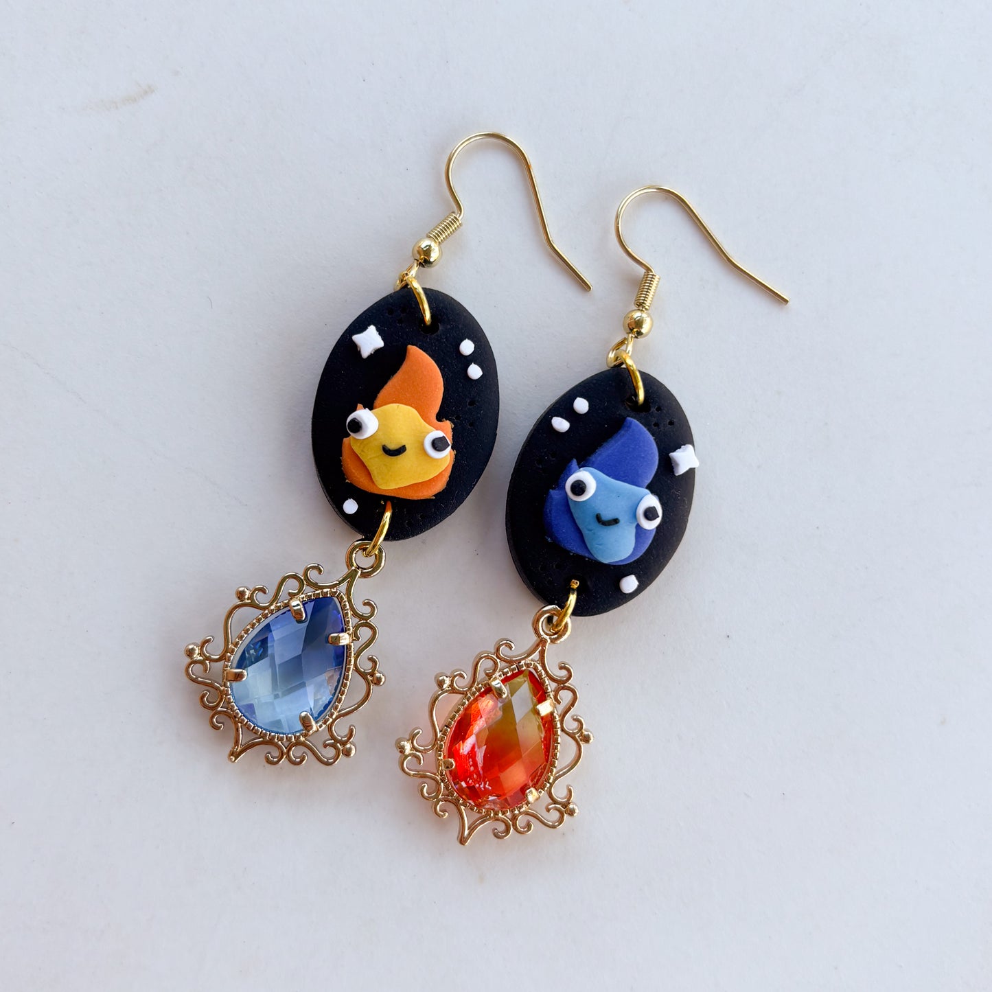MISMATCHED FLAME SPIRIT OVAL EARRINGS