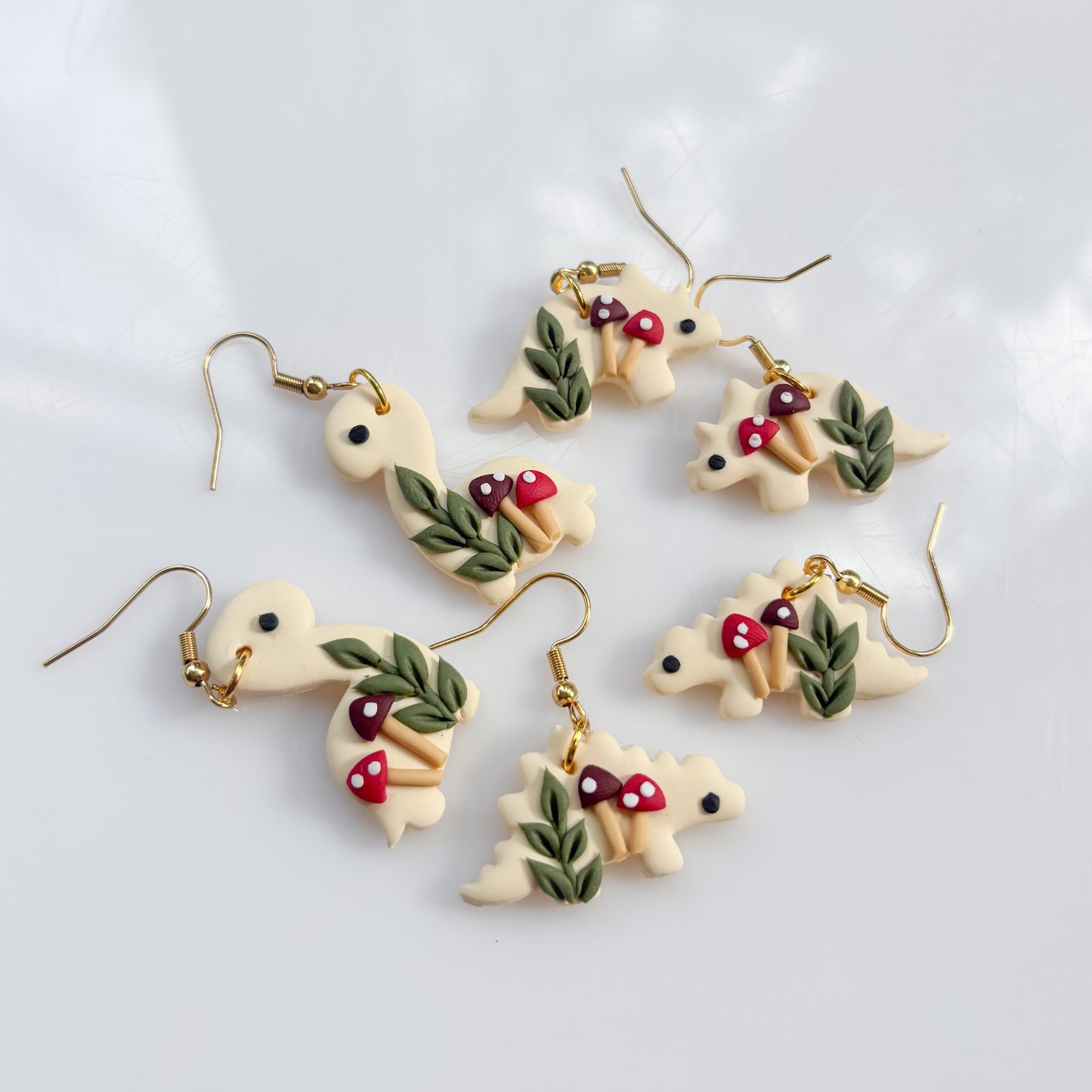 IVORY MUSHROOM DINO EARRINGS (STEGO)