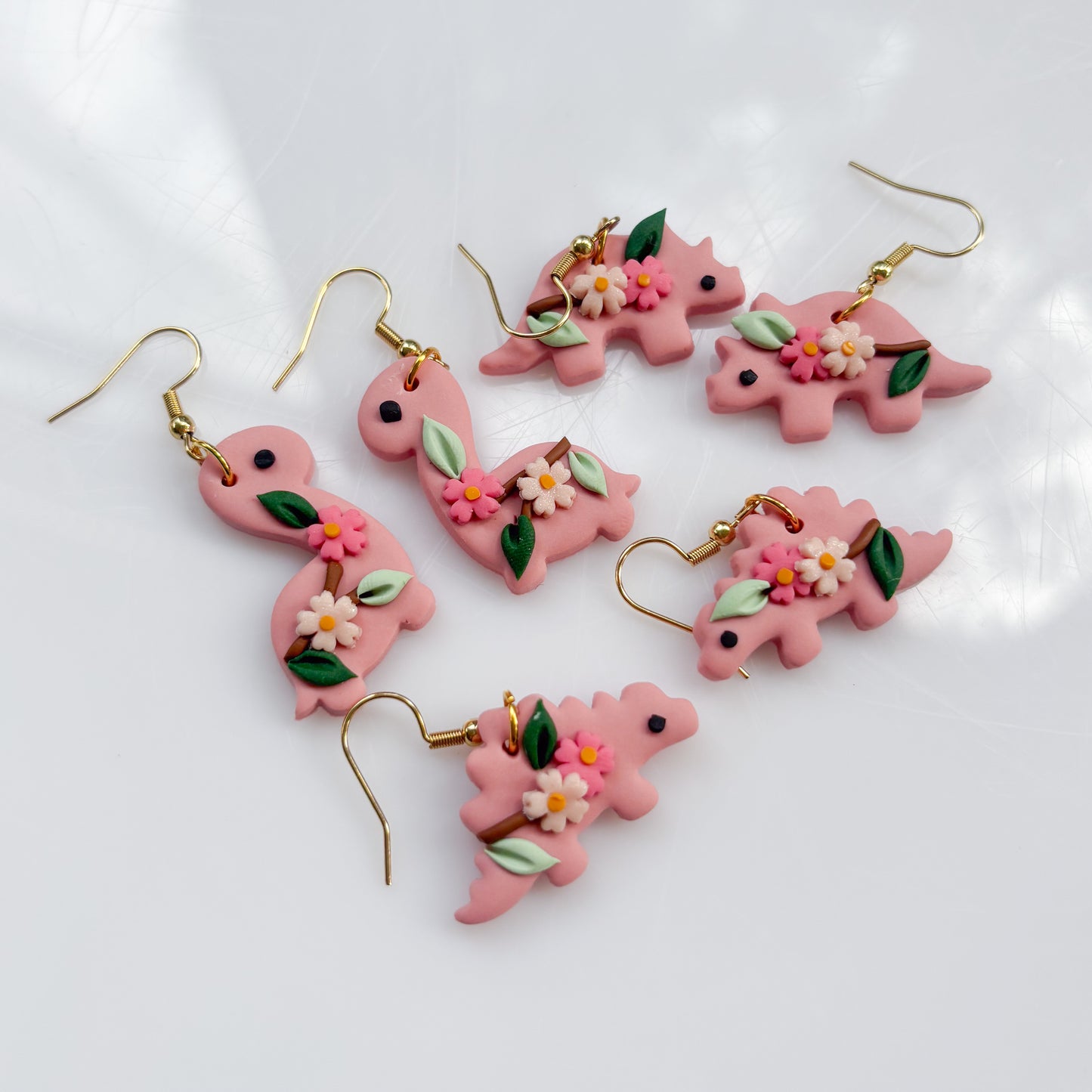 CHERRY BLOSSOM DINO EARRINGS (TRICERATOPS)