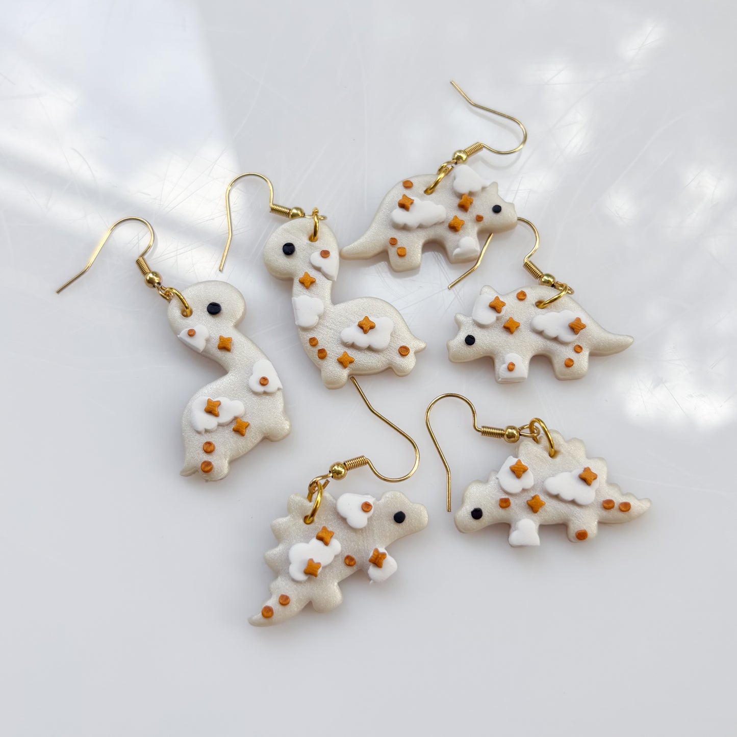 PEARL CLOUDY DINO EARRINGS (BRONTO)