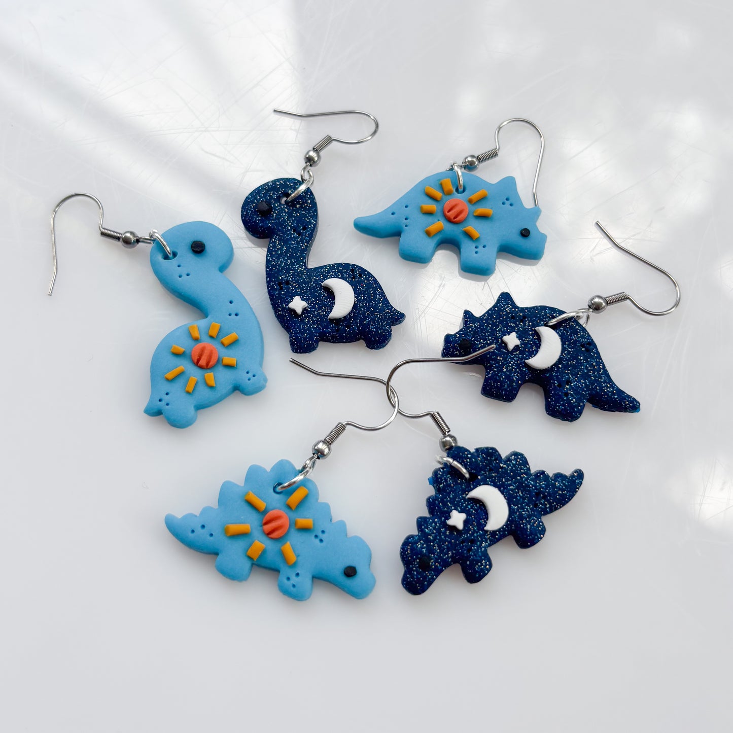 SUN & MOON DINO EARRINGS (STEGO)