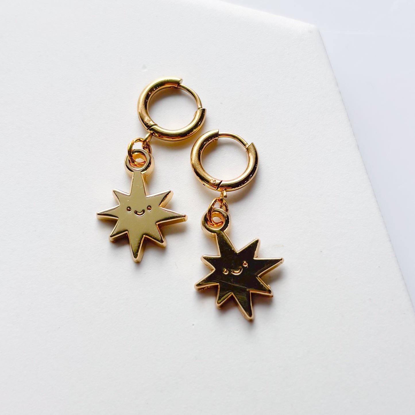 SMILING SPIKY STAR METAL HUGGIE HOOP EARRINGS