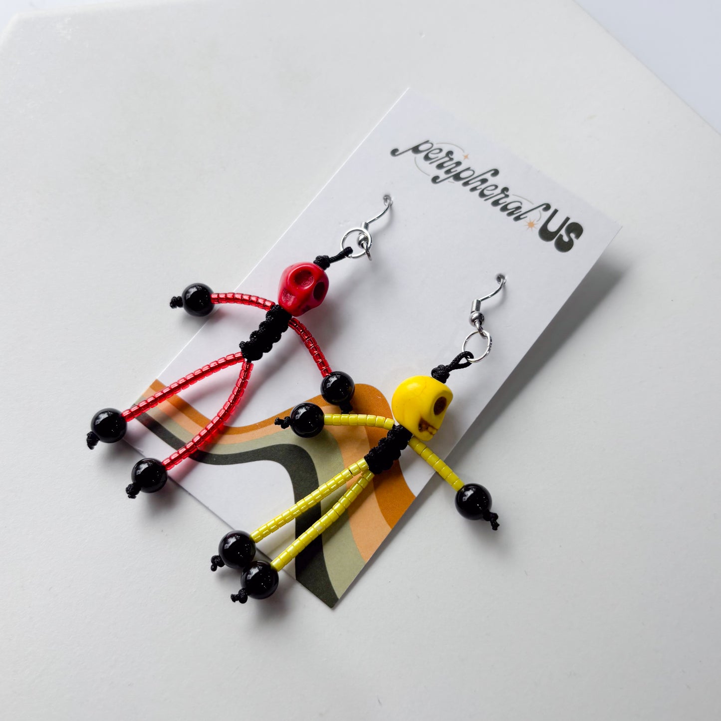 MISMATCHED SKELETON CHARM EARRINGS