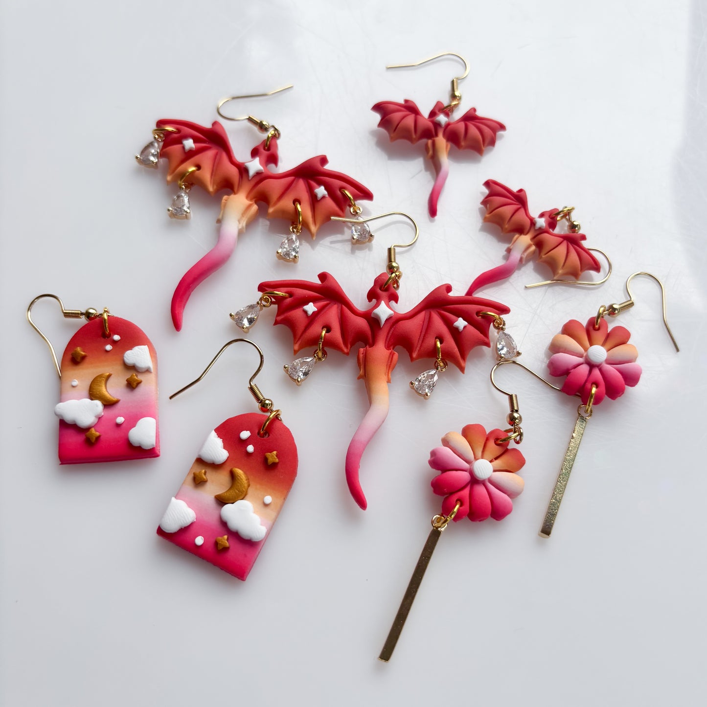 CLOUDY ARCH EARRINGS (LESBIAN FLAG)