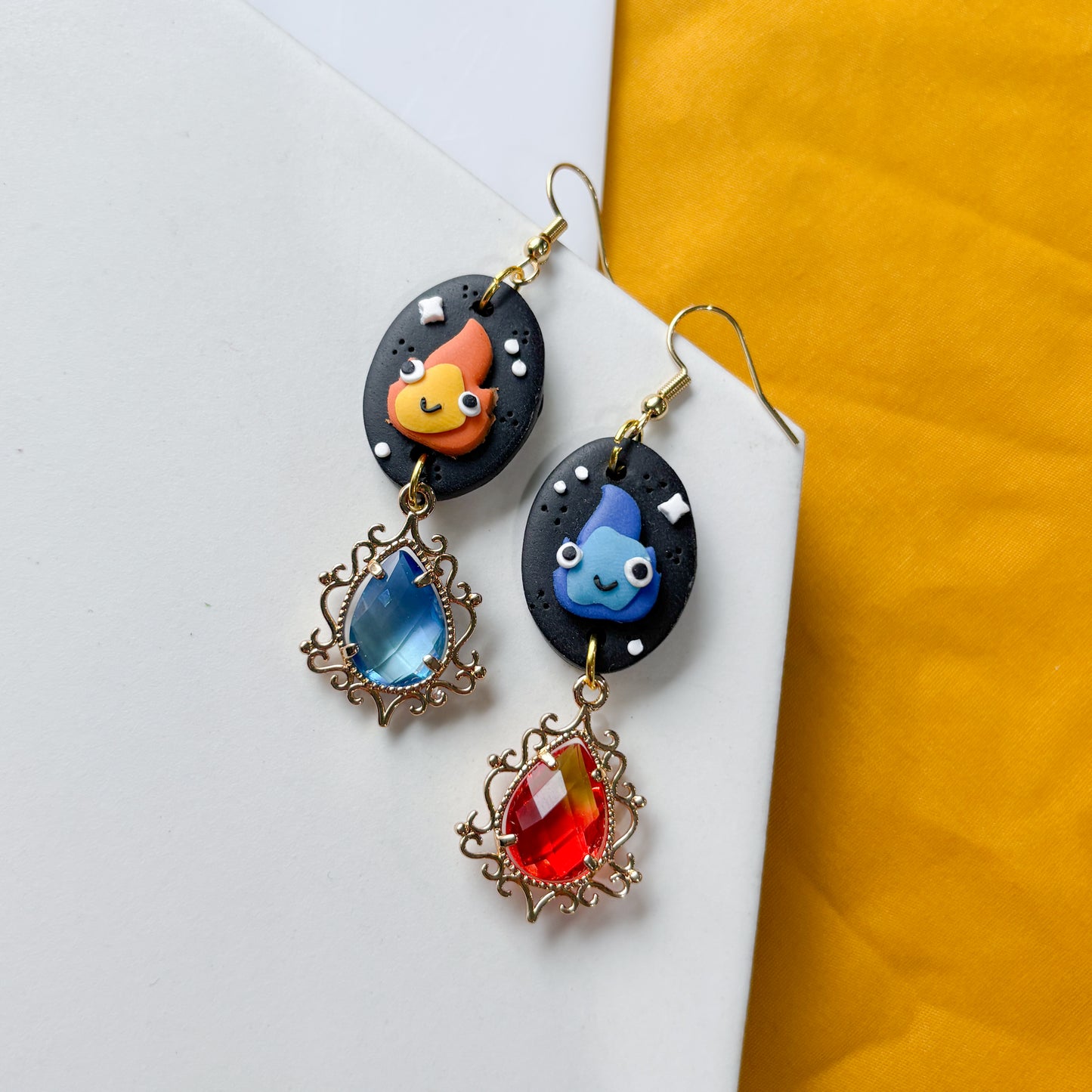 MISMATCHED FLAME SPIRIT OVAL EARRINGS
