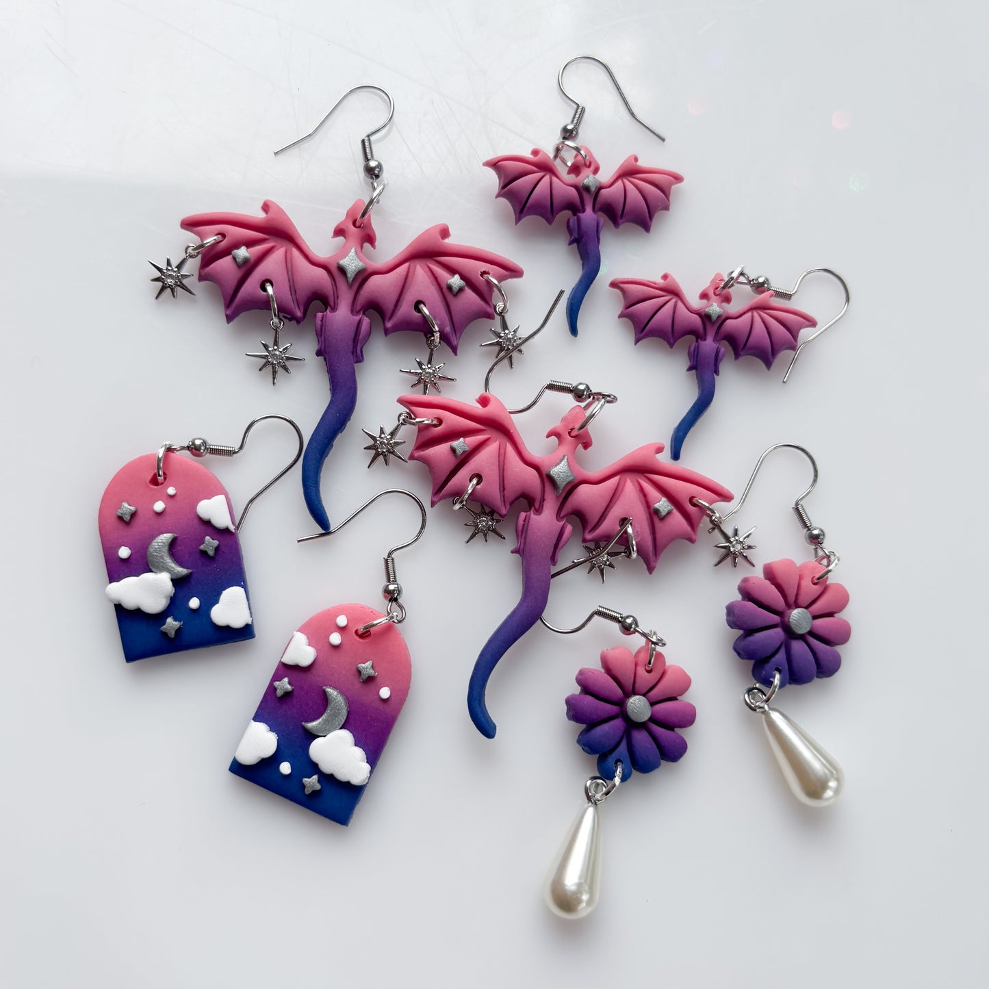 CLOUDY ARCH EARRINGS (BI FLAG)