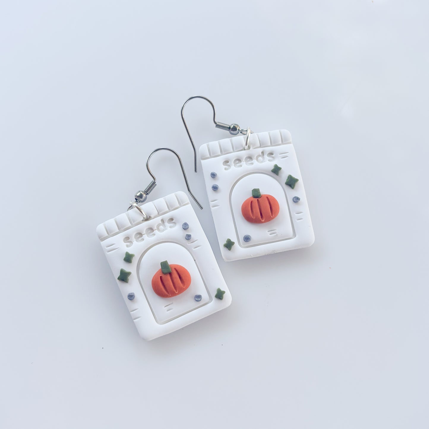 PUMPKIN SEED PACKET EARRINGS