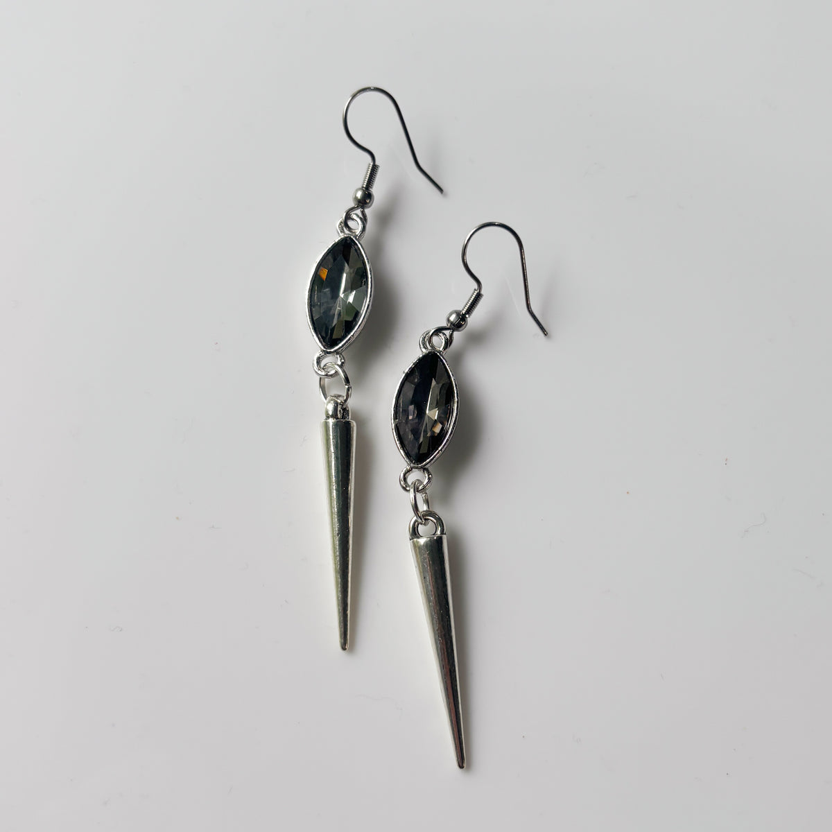 SMOKEY GREY OVAL SILVER SPIKE CHARM EARRINGS