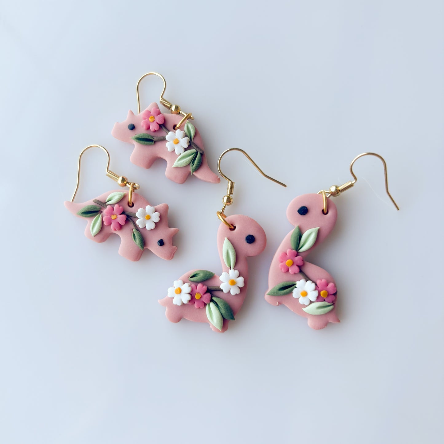 SAKURA DINO EARRINGS (TRICERATOPS)