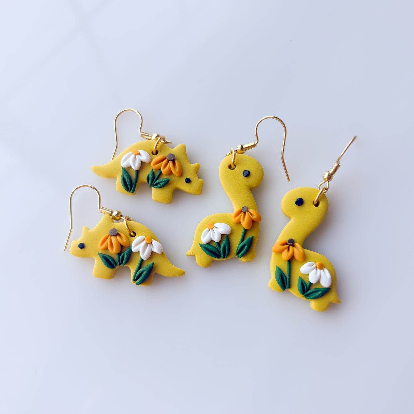 DAISY DINO EARRINGS (TRICERATOPS)