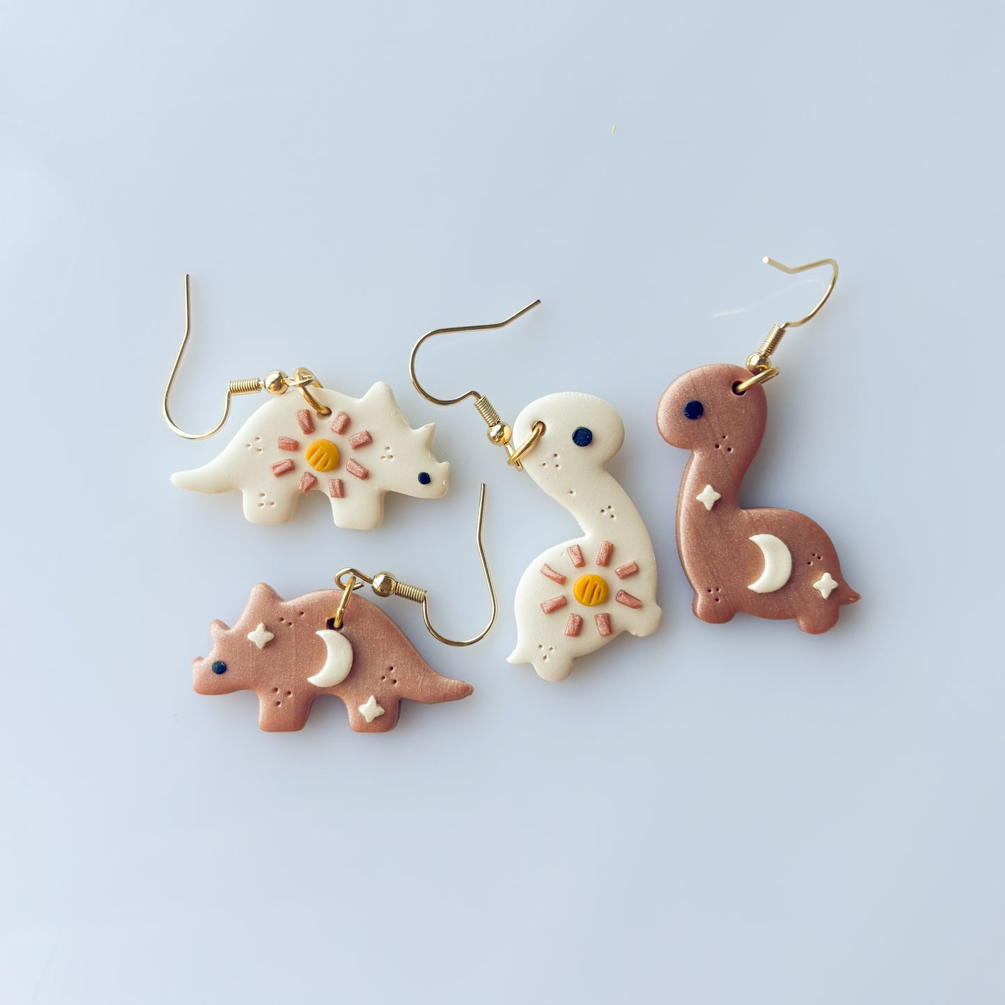 SUN & MOON DINO EARRINGS (TRICERATOPS)