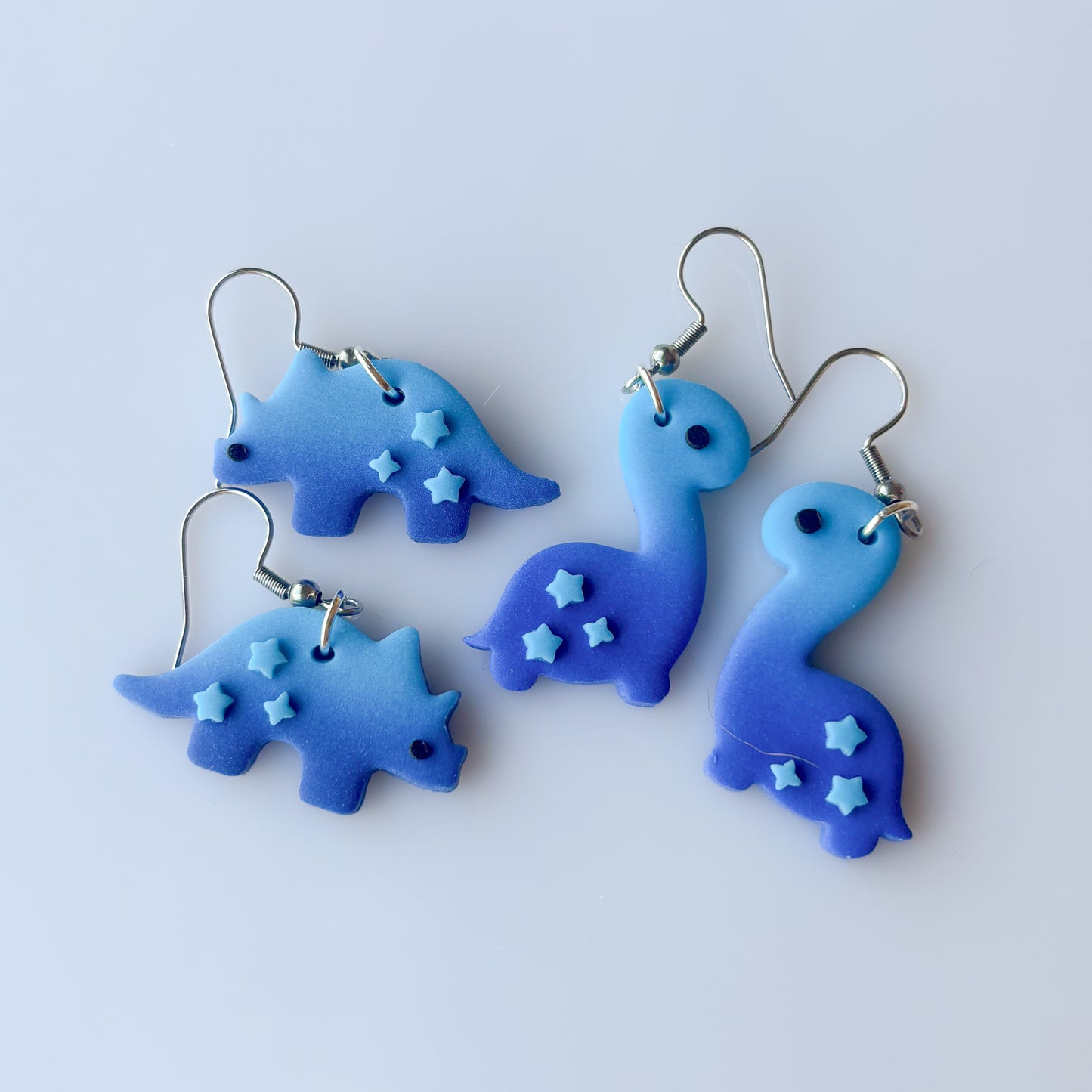 BLUE OMBRE DINO EARRINGS (TRICERATOPS)