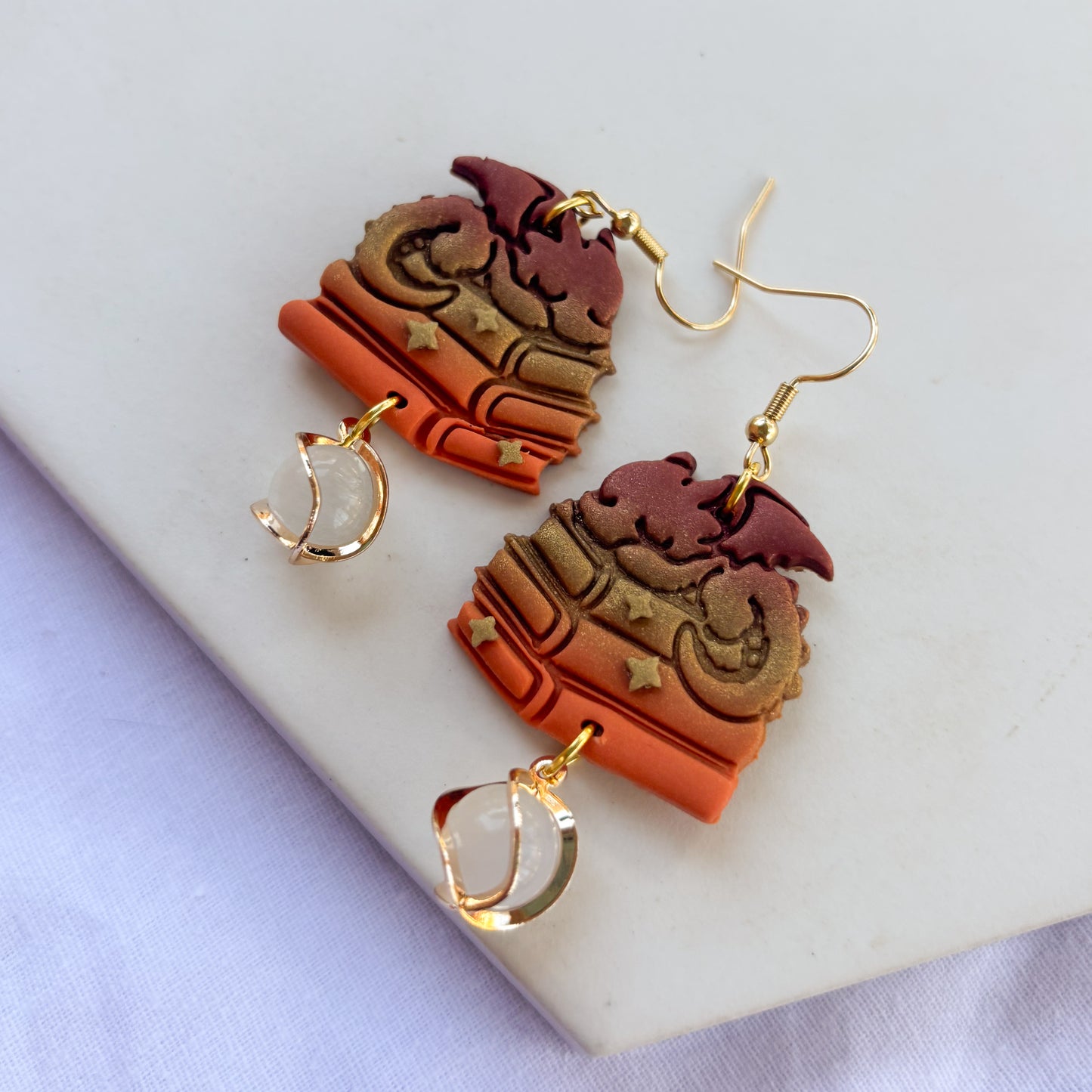 DRAGON ON BOOKS EARRINGS (BRICK BRONZE ORANGE)