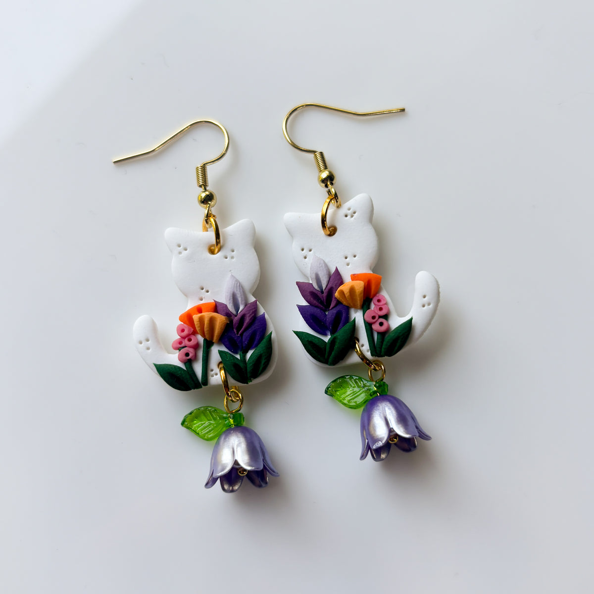 WHITE FLORAL CAT EARRINGS