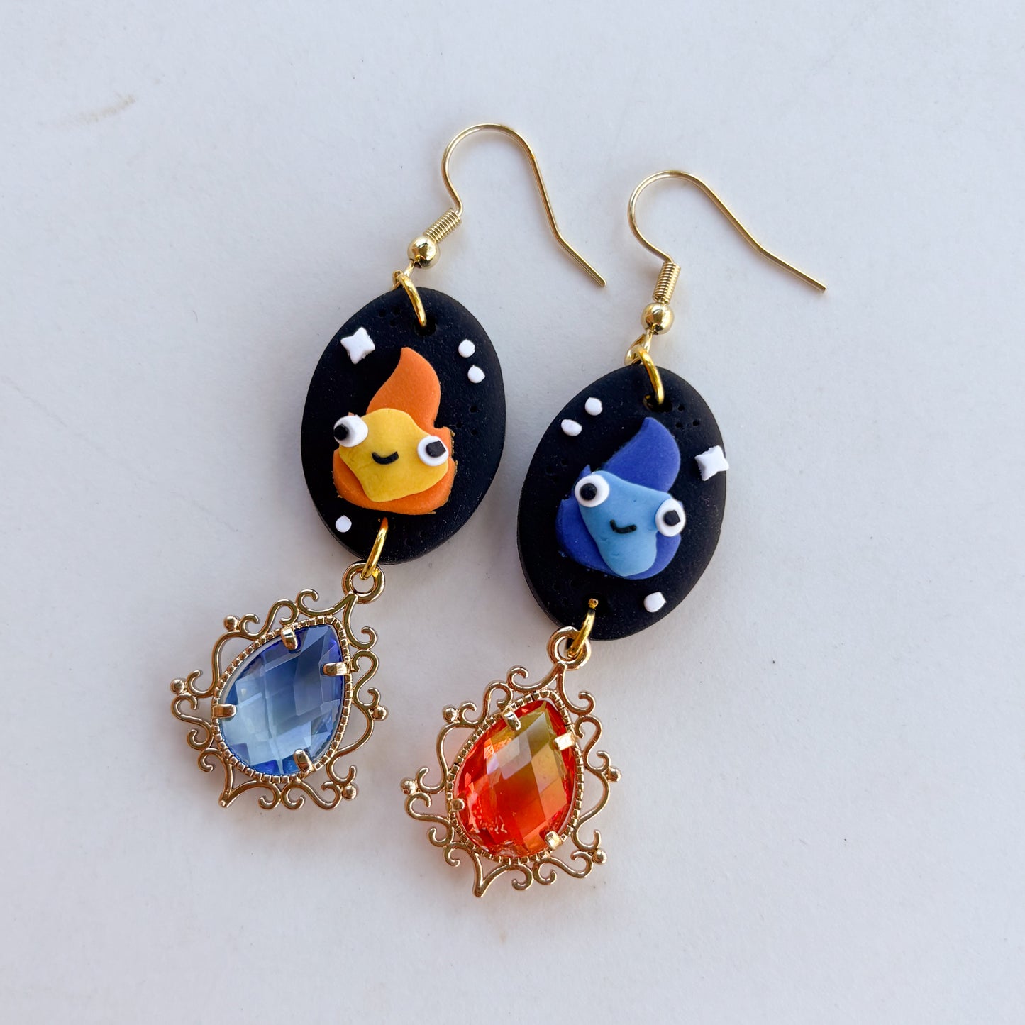 MISMATCHED FLAME SPIRIT OVAL EARRINGS