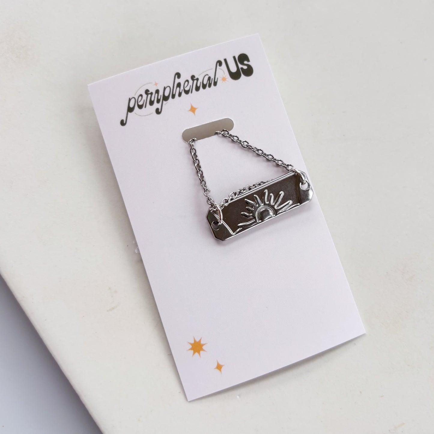 SILVER SUN CHARM NECKLACE