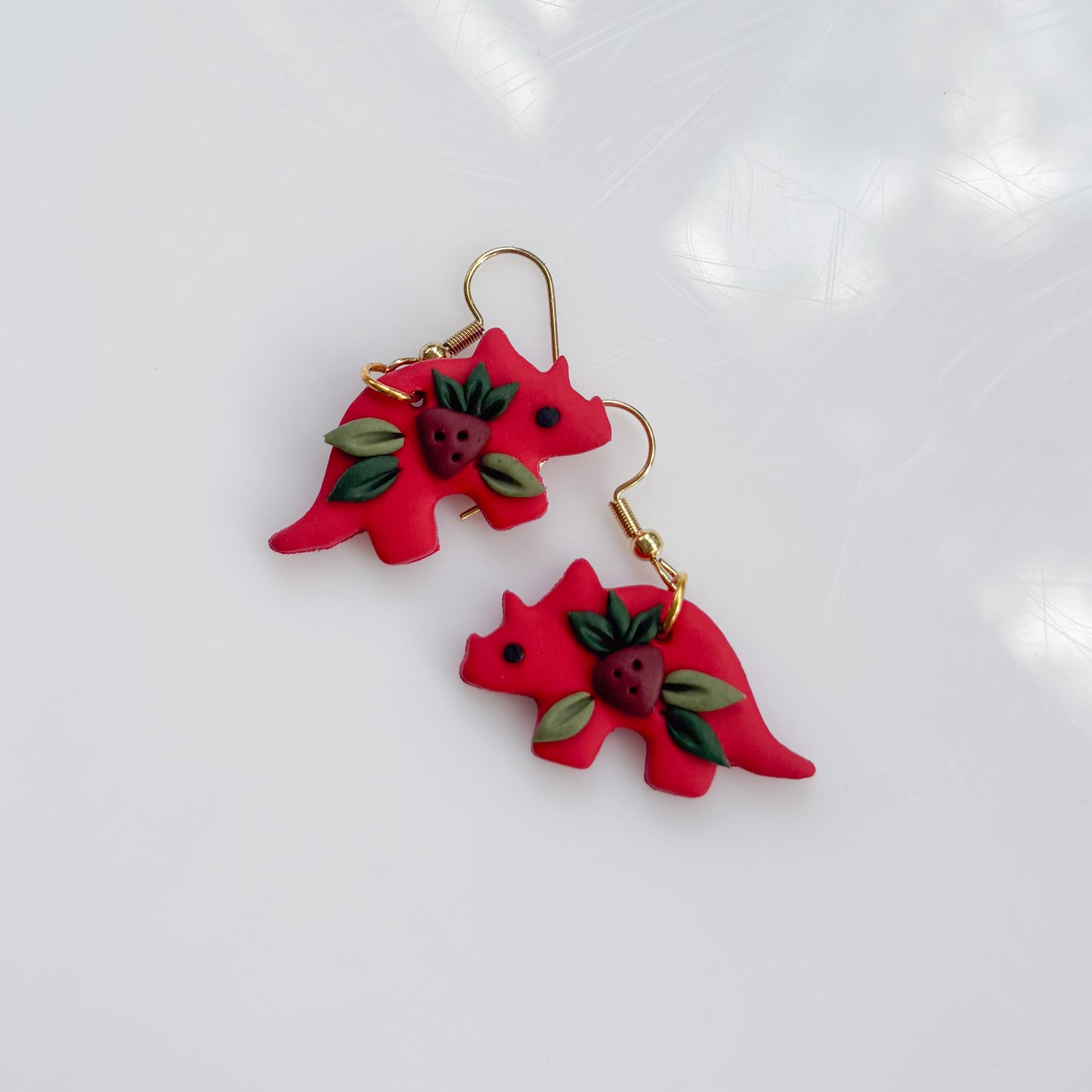 RED STRAWBERRY DINO EARRINGS (TRICERATOPS)