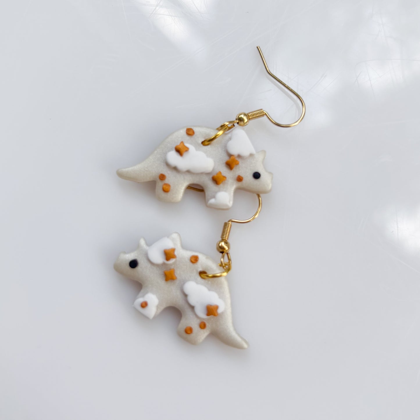 PEARL CLOUDY DINO EARRINGS (TRICERATOPS)