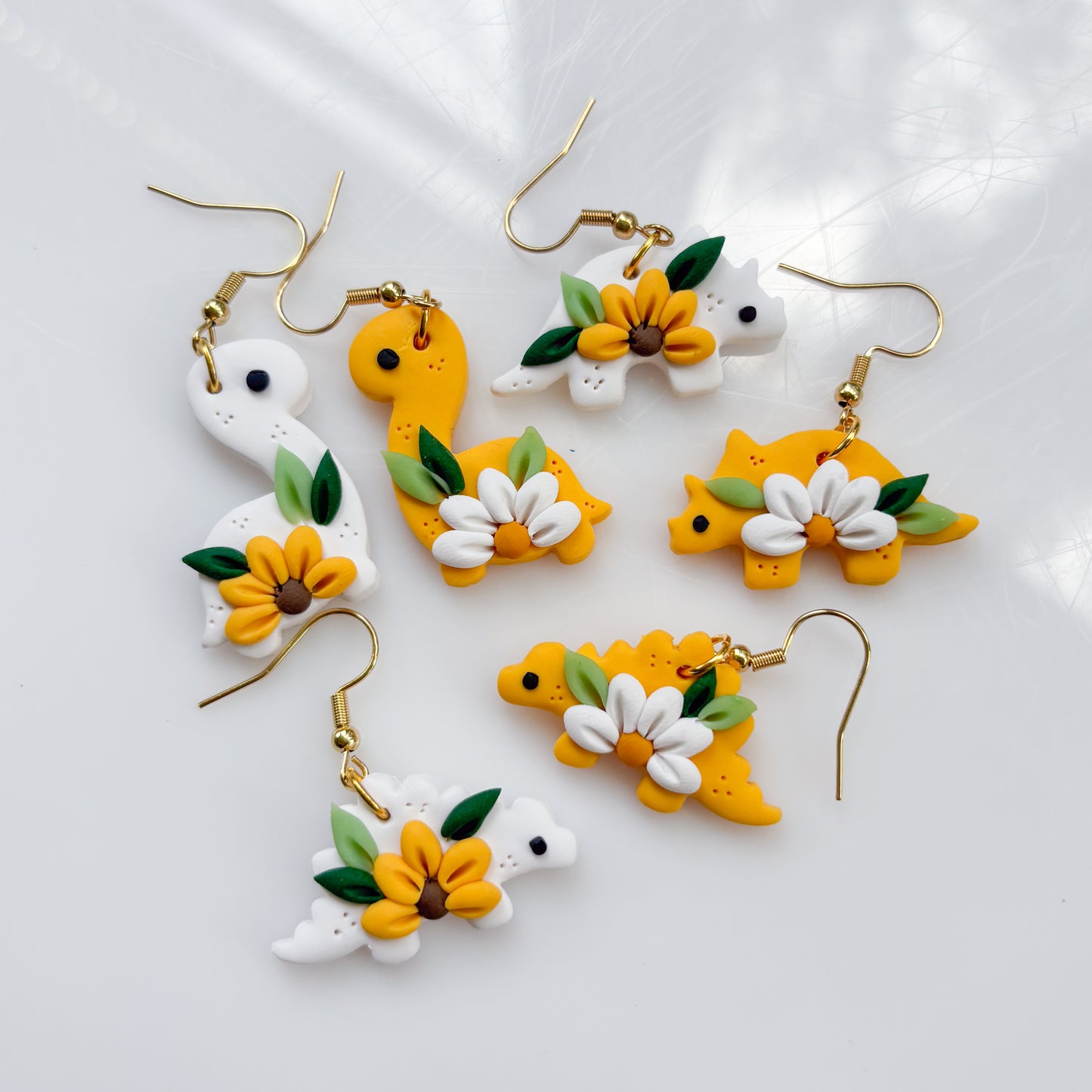 MISMATCHED DAISY SUNFLOWER DINO EARRINGS (TRICERATOPS)