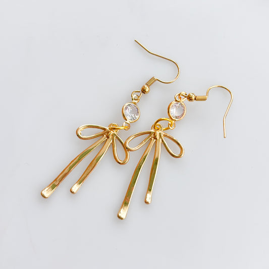 LONG GOLD BOW & GEM CHARM EARRINGS