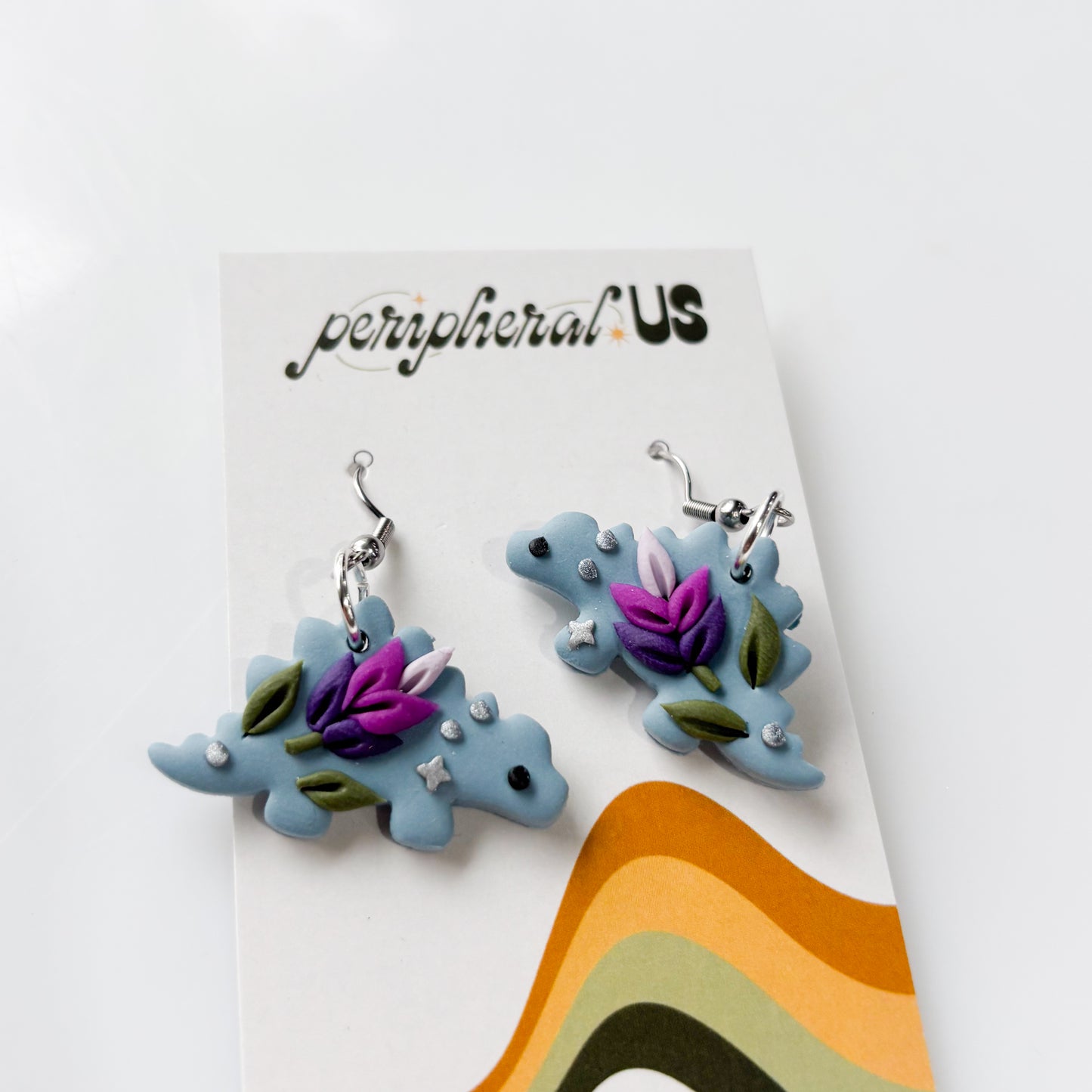 DUSTY BLUE LAVENDER STEGO DINO EARRINGS