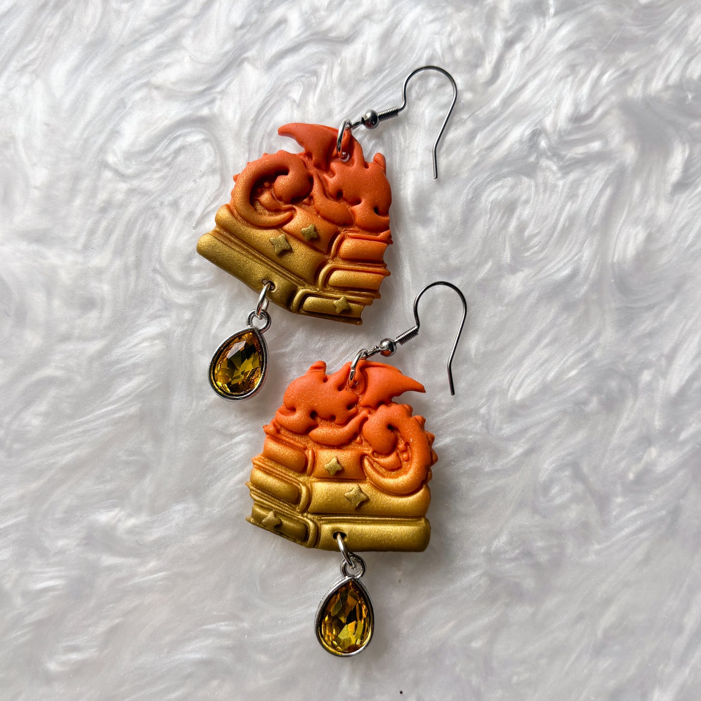 ORANGE DRAGONS ON BOOKS EARRINGS