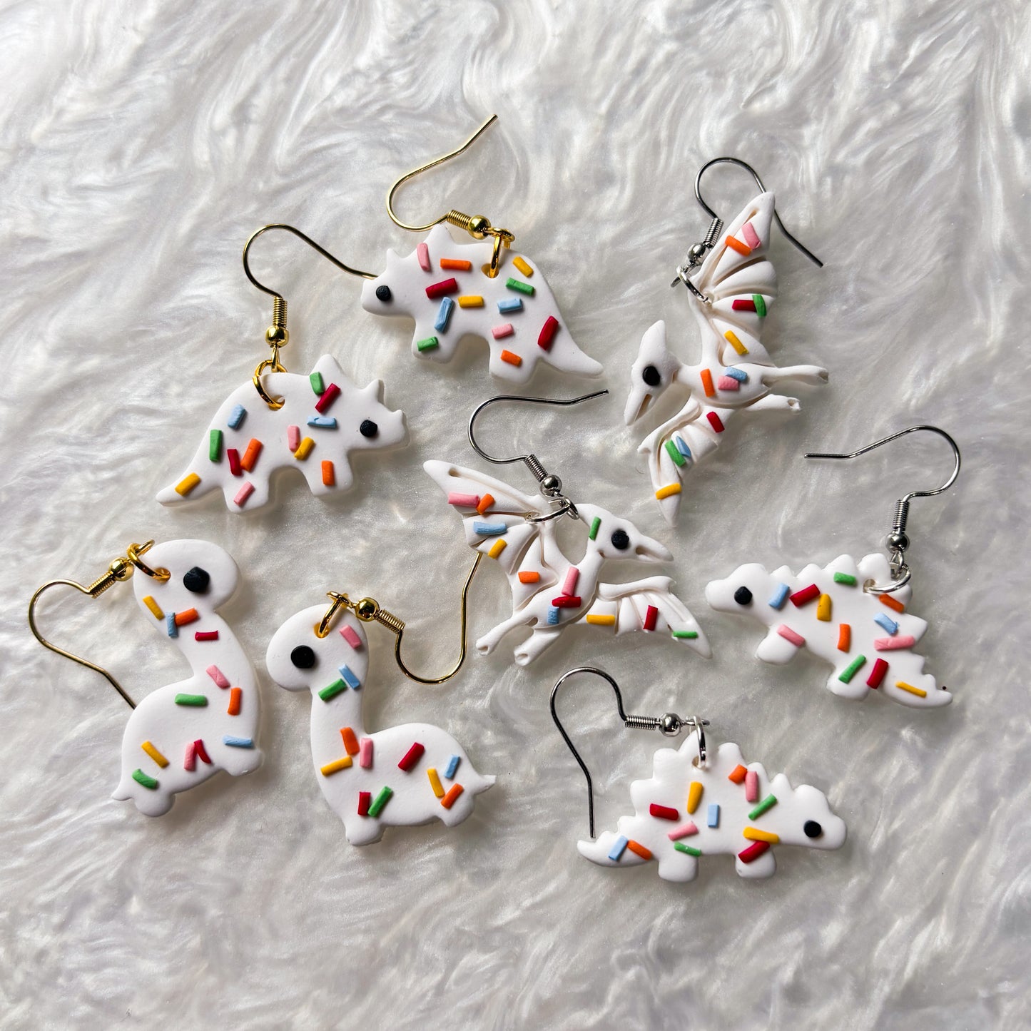 RAINBOW SPRINKLE DINO EARRINGS (TRICERATOPS)