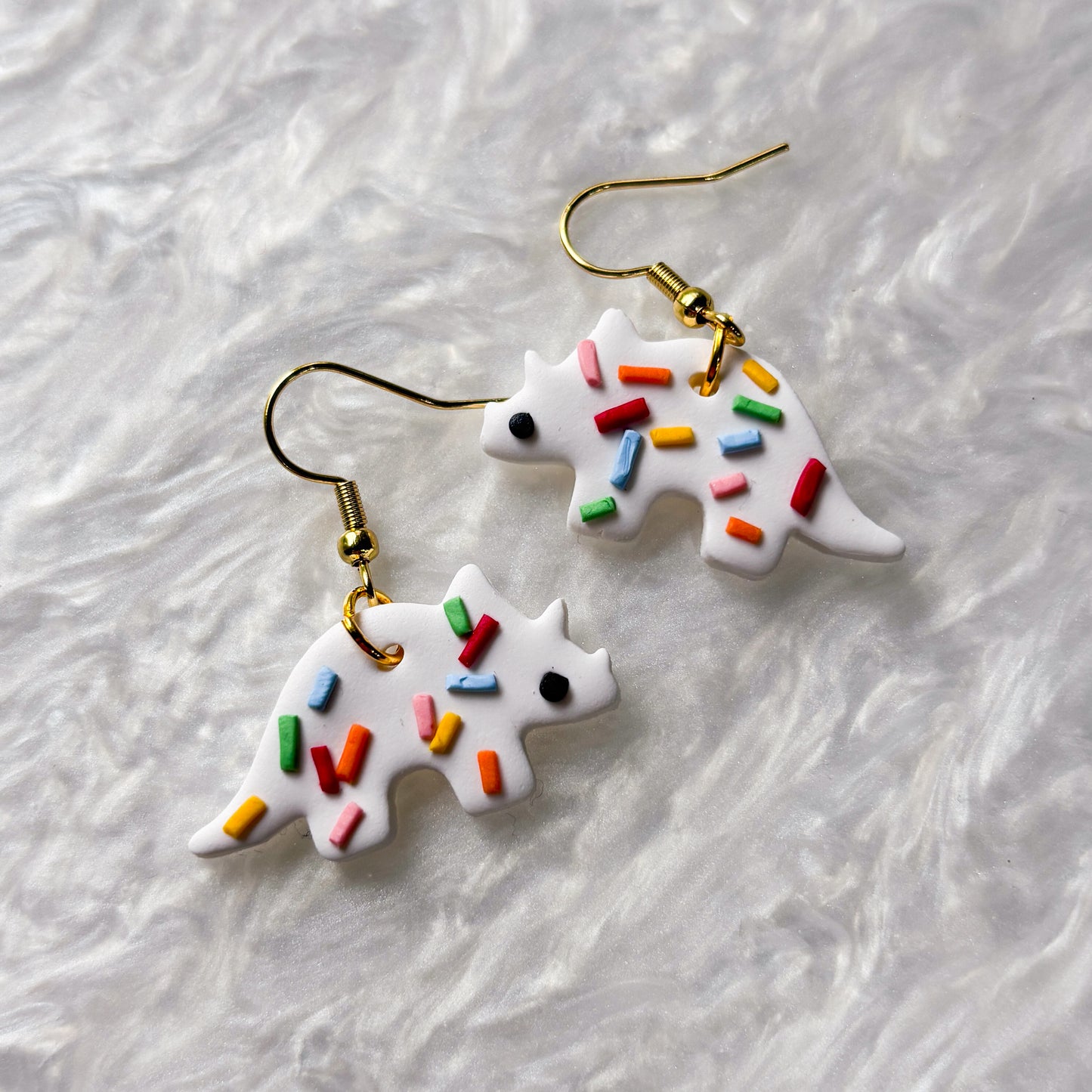 RAINBOW SPRINKLE DINO EARRINGS (TRICERATOPS)