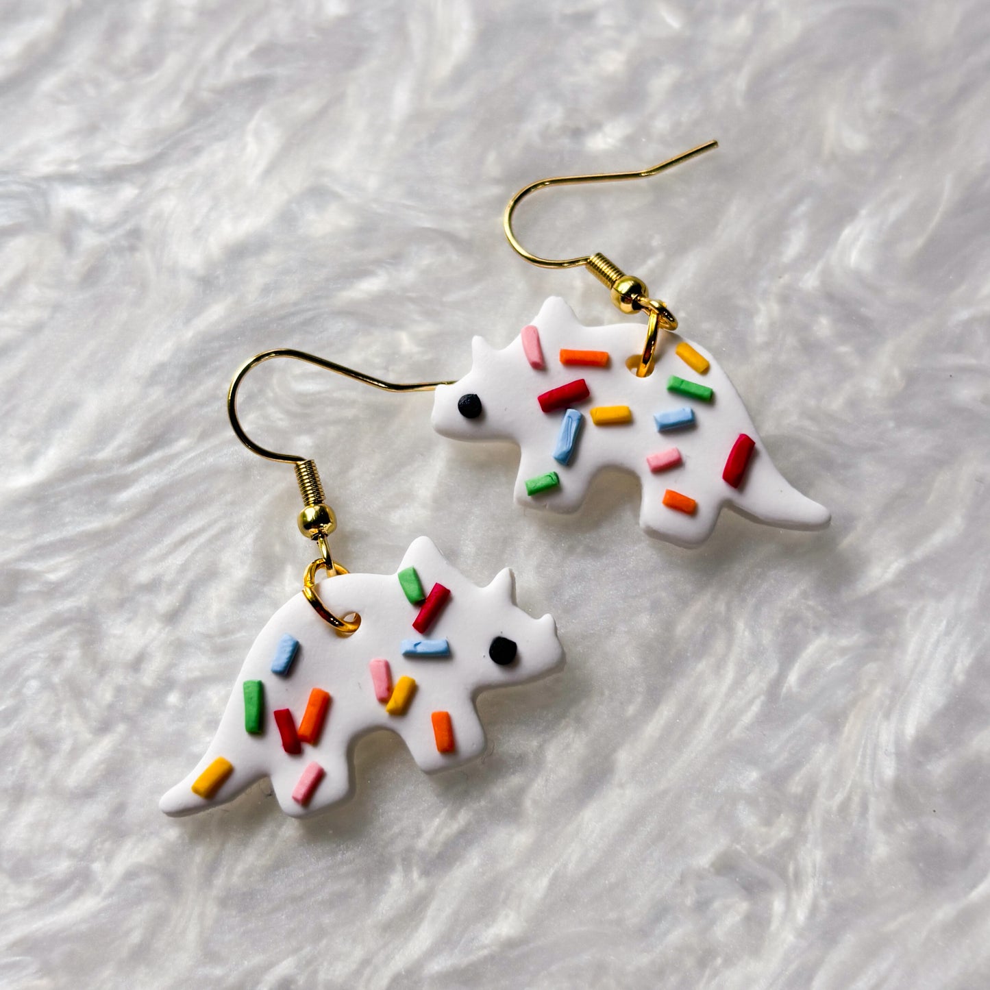 RAINBOW SPRINKLE DINO EARRINGS (TRICERATOPS)
