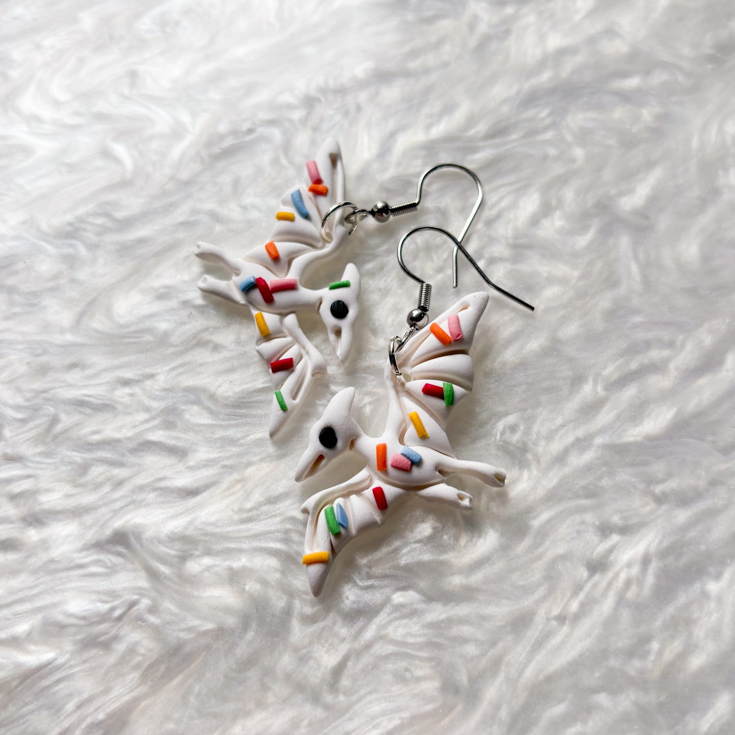 RAINBOW SPRINKLE DINO EARRINGS (PTERODACTYL)