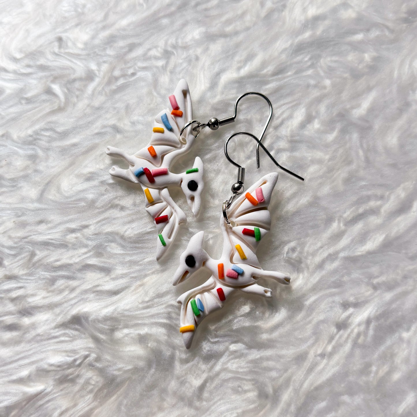 RAINBOW SPRINKLE DINO EARRINGS (PTERODACTYL)