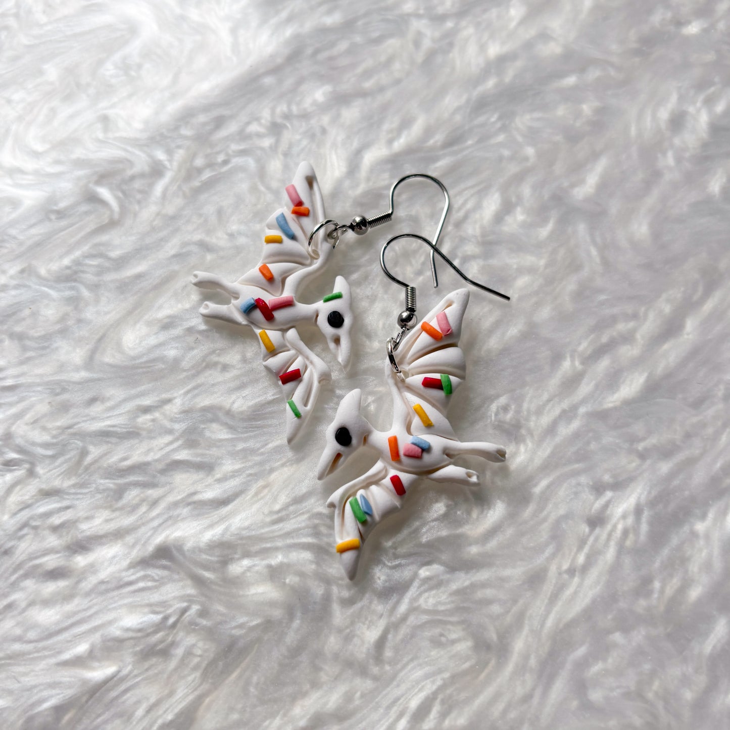 RAINBOW SPRINKLE DINO EARRINGS (PTERODACTYL)
