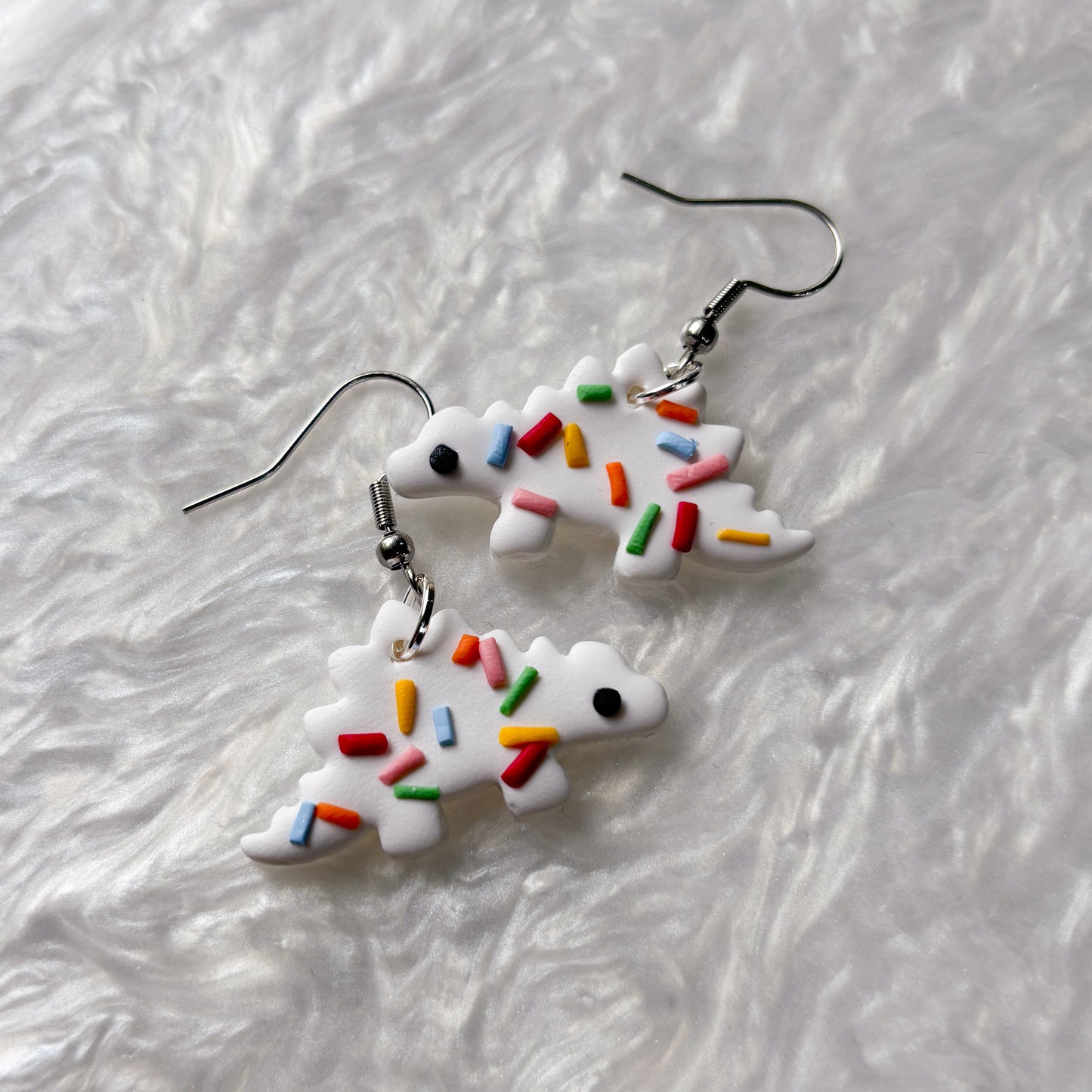 RAINBOW SPRINKLE DINO EARRINGS (STEGOSAURUS)