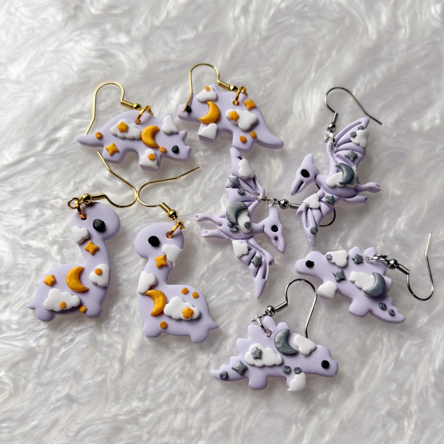 PURPLE CELESTIAL DINO EARRINGS (TRICERATOPS)