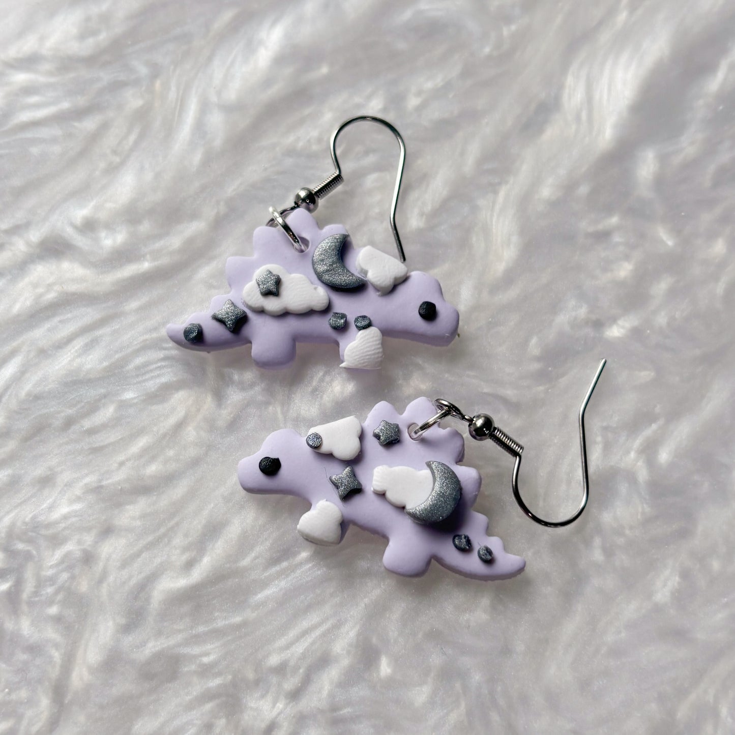 PURPLE CELESTIAL DINO EARRINGS (STEGOSAURUS)