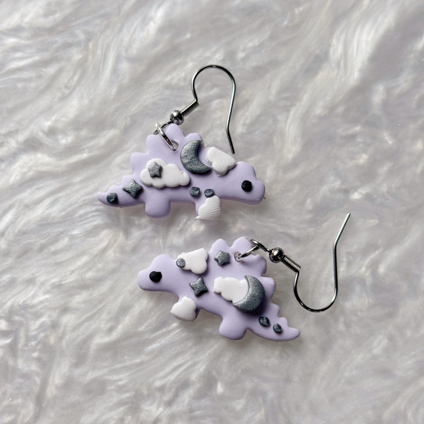 PURPLE CELESTIAL DINO EARRINGS (STEGOSAURUS)