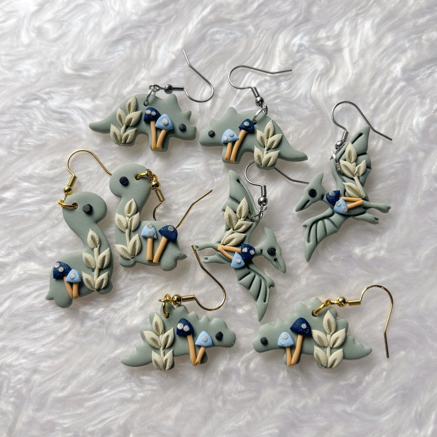 BLUE MUSHROOM DINO EARRINGS (TRICERATOPS)