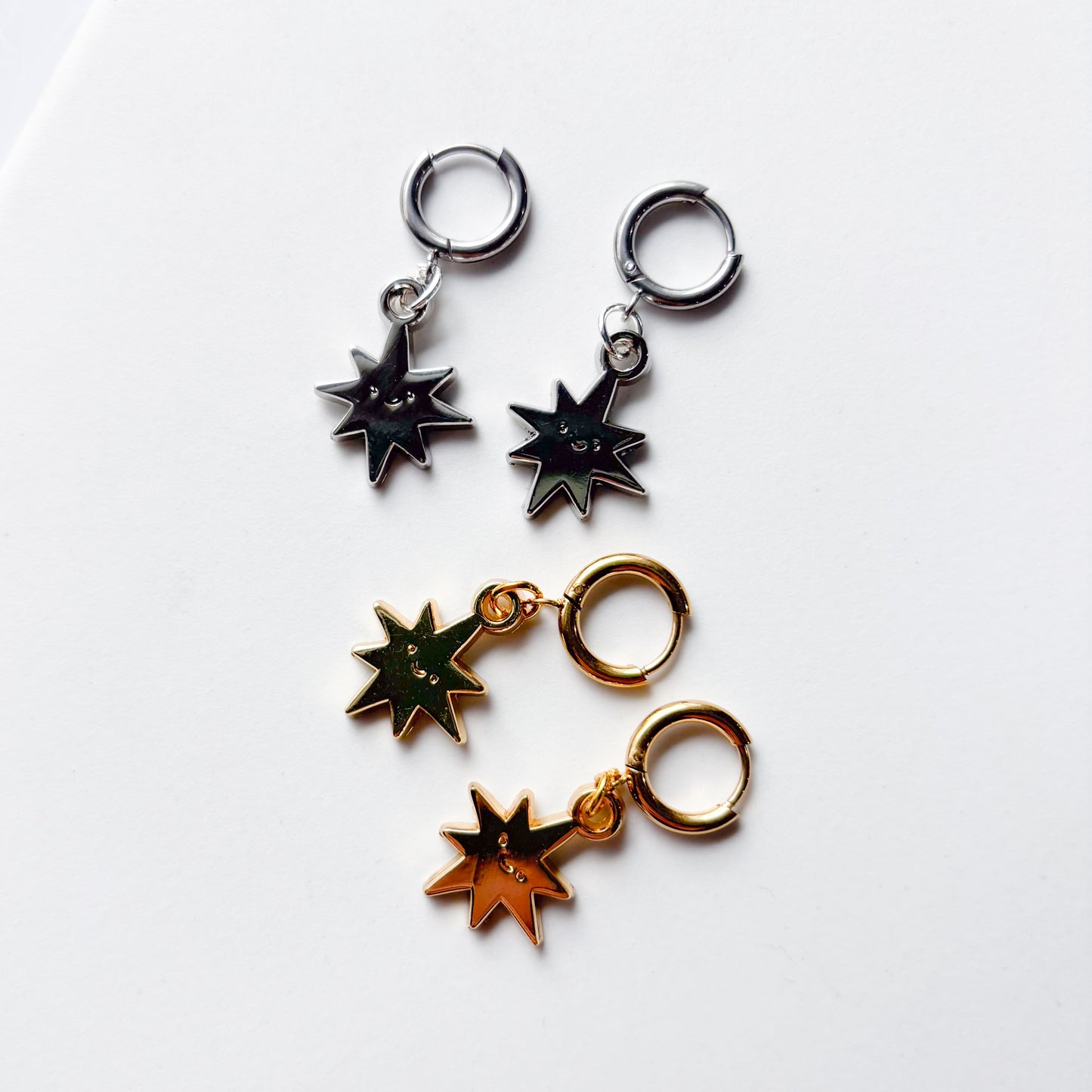 SMILING SPIKY STAR METAL HUGGIE HOOP EARRINGS