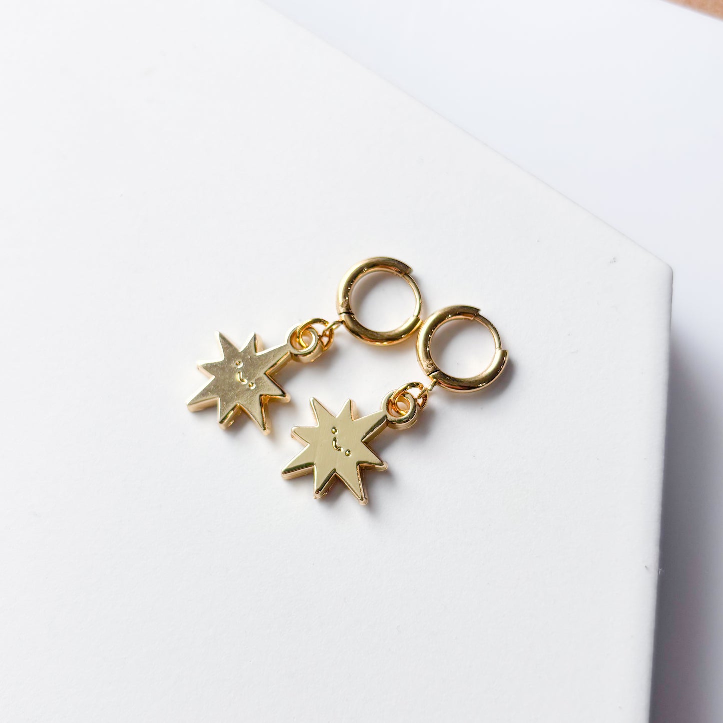 SMILING SPIKY STAR METAL HUGGIE HOOP EARRINGS