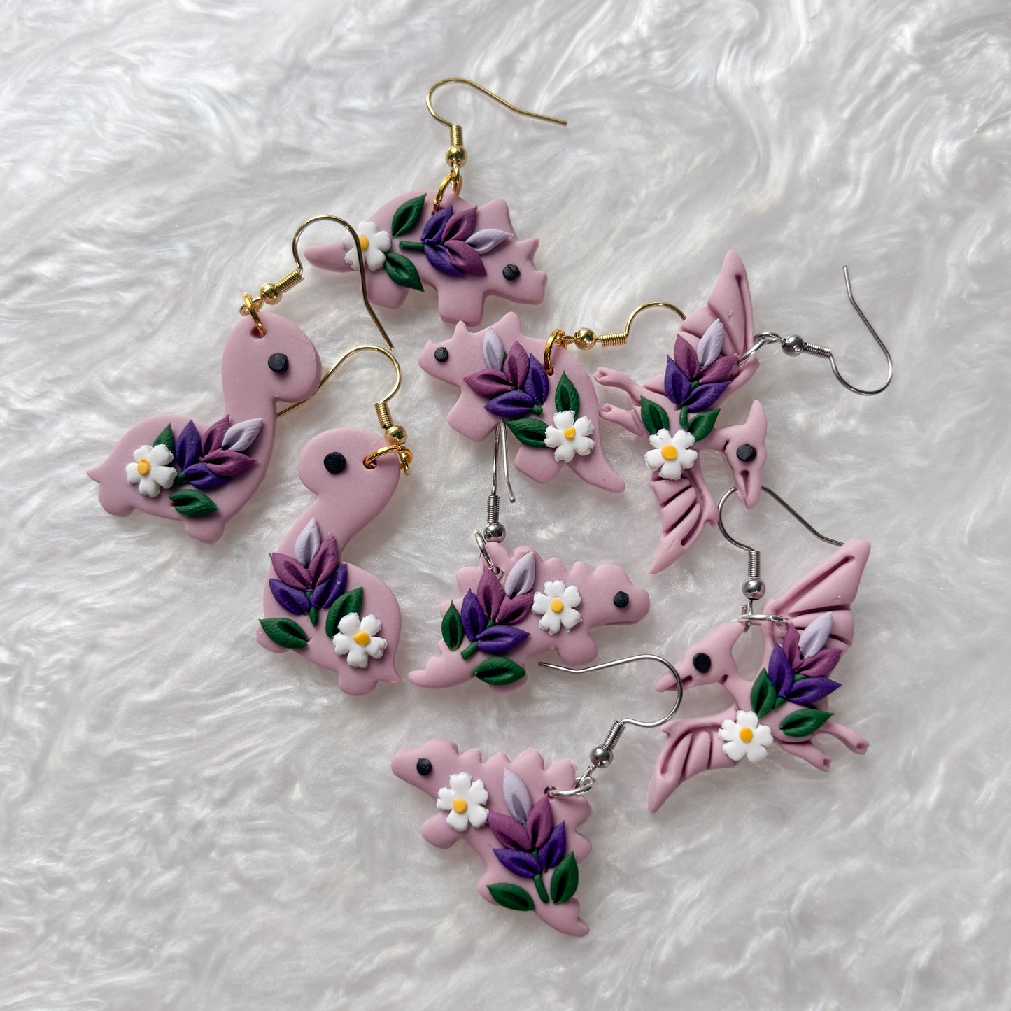 LAVENDER DINO EARRINGS (STEGOSAURUS)
