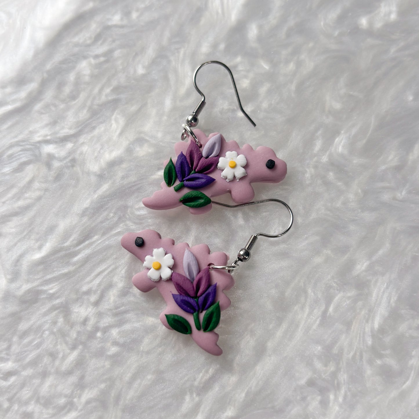 LAVENDER DINO EARRINGS (STEGOSAURUS)